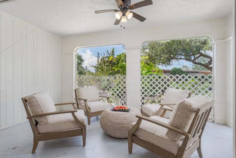 The screened lanai has 4 soft & cushy teak chairs.  Enjoy a glass of wine with friends