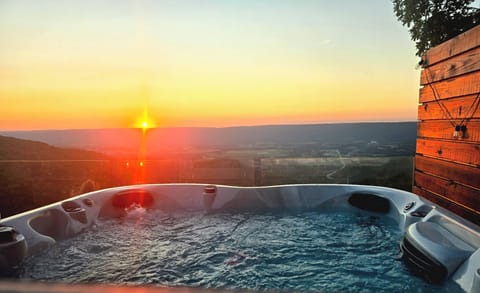Watch sunset in the hot tub after a day of hiking 