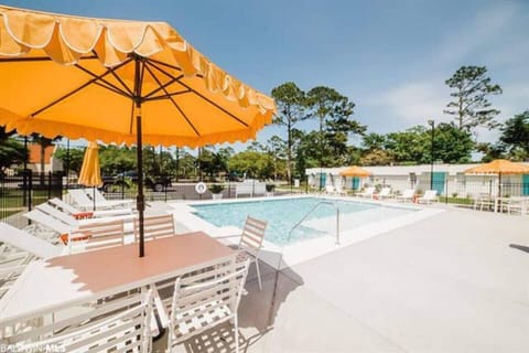 Poolside Paradise: Dive into relaxation with vibrant umbrellas and inviting lounge spots!