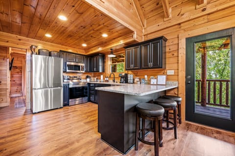 FULLY stocked kitchen with all the gadgets, swivel seats at the bar, the coffee maker makes drip and k-cups, plus there is a kettle for the tea lovers!