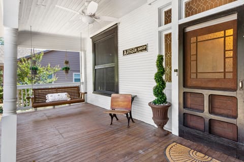 Enjoy a cup of coffee while swinging on the bench on the large front porch.
