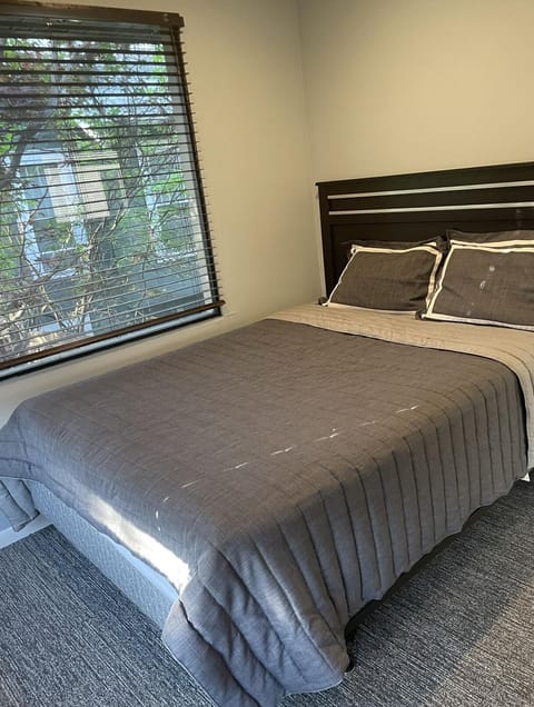 Main level queen bed and bedroom