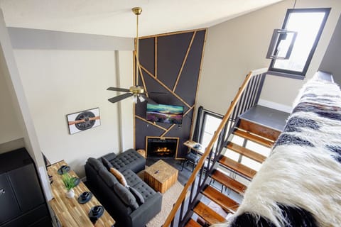 A view of the living room with modern design and cozy seating.