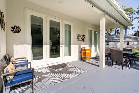 AL FRESCO DINING: Zoom in on our outdoor relaxation and dining area from a closer perspective. Two inviting single-seater chairs offer a cozy spot to unwind, while a spacious 6-seater dining set, crafted from elegant rattan with comfortable cushions, beckons for memorable al fresco gatherings. Enjoy the charm of our outdoor space from every angle.