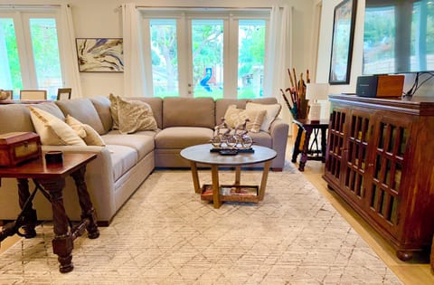 Our open floor plan features a comfortable sectional to enjoy movie nights!