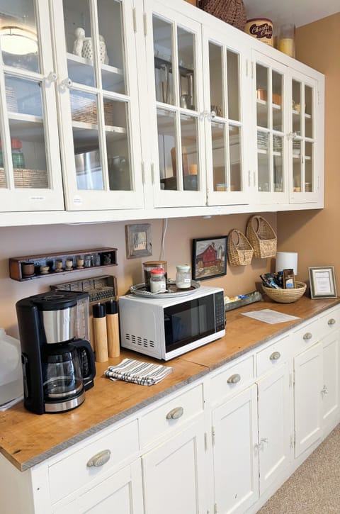 Kitchenette with storage space, dishes/utinsels, microwave, toaster, c. maker