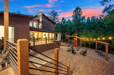 Backyard—hot tub, fire pit, playset, swings, bbq, hammock, porch with TV.  