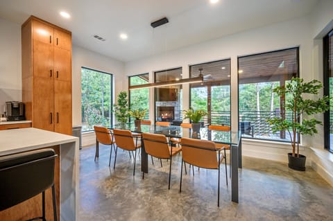 Dining Room—10’ steel framed glass dining table that seats 8. 