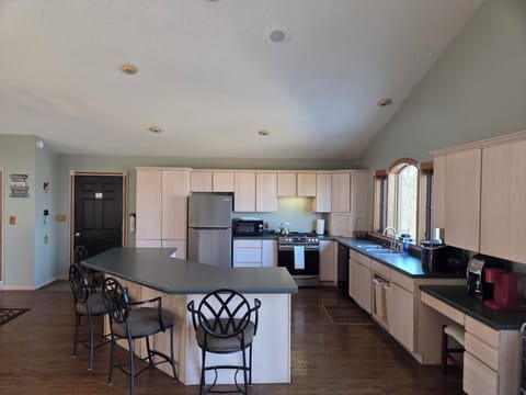 Large kitchen with seating for four at island counter