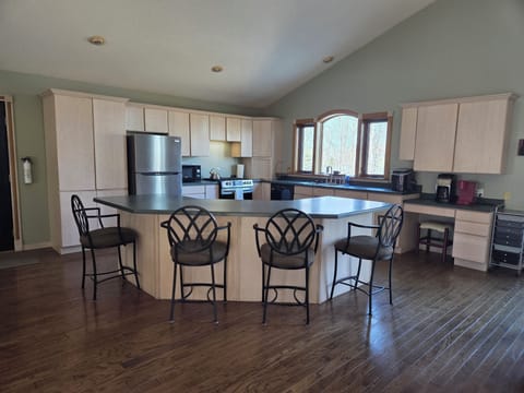 Large kitchen with seating for four at island counter