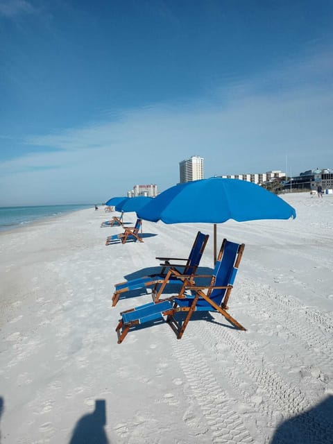 Enjoy the beautiful white sands. We include 2 beach chairs and umbrella service