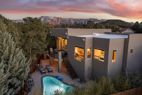 Home 1: Cool off in the sparkling pool/spa behind the privacy of pine trees