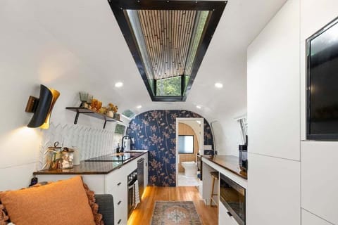 You are going to love the raised ceiling and sky light.  Just wait until you see the uplighting at night in the skylight!