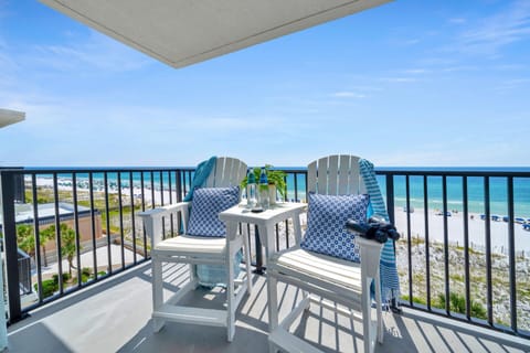 Unwind on your private balcony with two comfy chairs and a small table, perfectly positioned for morning coffee and breathtaking ocean views.
