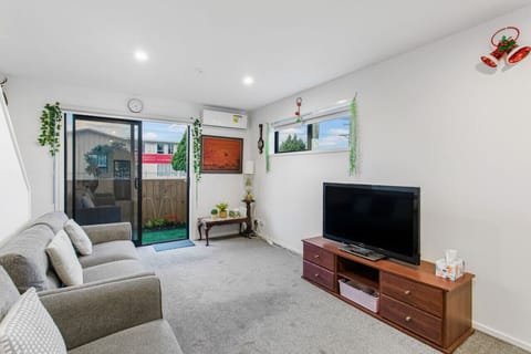 Relax in the living room and watch TV on the flatscreen TV.