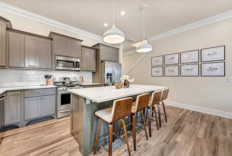 Island seating swivel chairs keep you connected to the kitchen & living spaces.