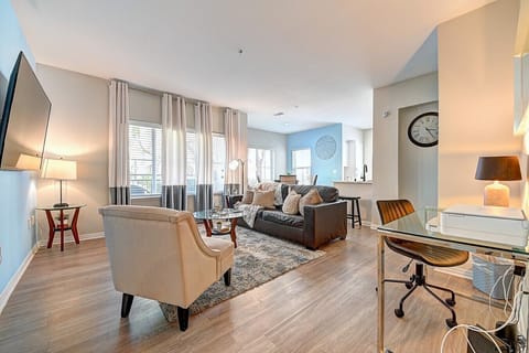 Relax and unwind in the bright living room, complete with a 55` Smart TV and a fully equipped desk space perfect for remote work