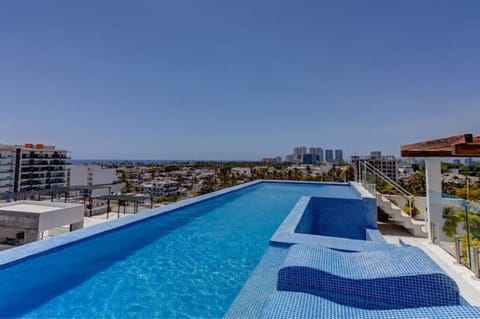 Infinity Rooftop Pool with views of the ocean and mountains.