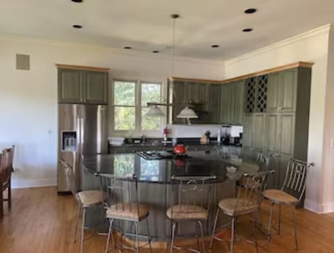 Kitchen and counter with stools