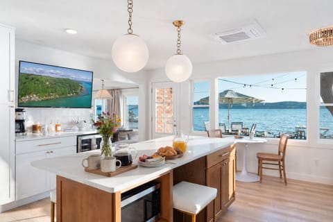Start your morning slowly as the serenity of Crystal Lake awakens around you. Sip your coffee at the island while the water gently comes to life just beyond the windows—calm, quiet, and effortlessly grounding. It’s a peaceful beginning that invites you to