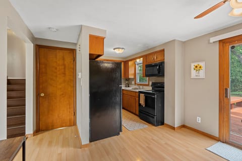 The main floor features living room, dining area, and full kitchen