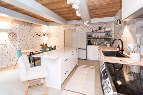 With a custom built, extended island, our guests can easily enjoy time together while preparing meals!