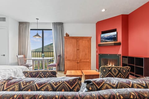The Mason at Stillwater 3005: Cozy ambiance with a sofa set, center table, and fireplace."