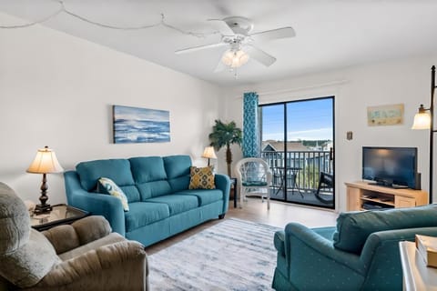 Light & bright conversational living space with walk out to private balcony
