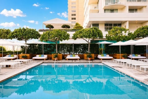 Sunset Pool • Daybeds, Umbrellas & Building Views
