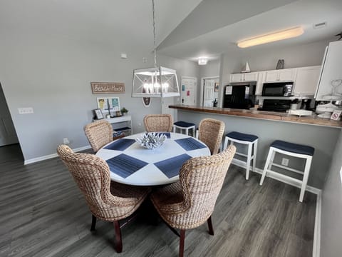 Spacious eating area for your entire crew. Table seats 6 w/ 4 bar stools at bar.