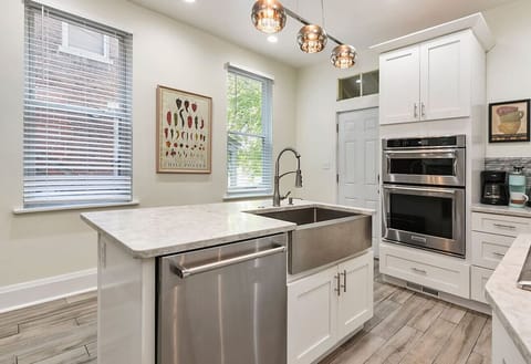 Cook, Gather, Connect – This modern, light-filled kitchen makes it easy to whip up meals and gather around for good conversation and great food.