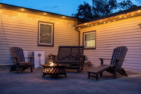 Outdoor firepit at night, new outdoor lights provide twinkling ambience!