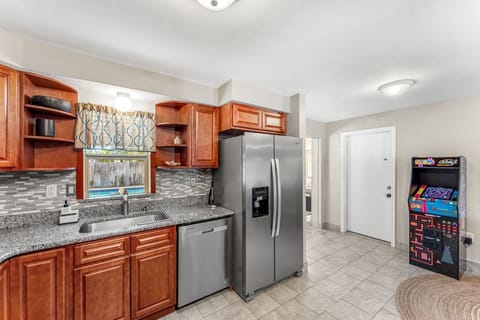 Double-door fridge, dishwasher, and ample space.