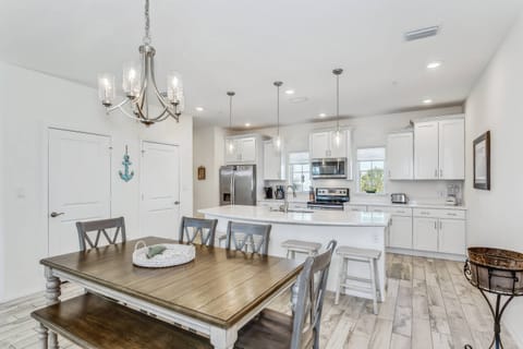 When it is meal time plenty of seating at both the dining room table and island bar.