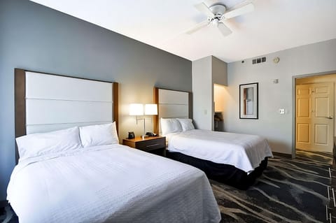 Unwind in a bright double-bed room with plush linens.