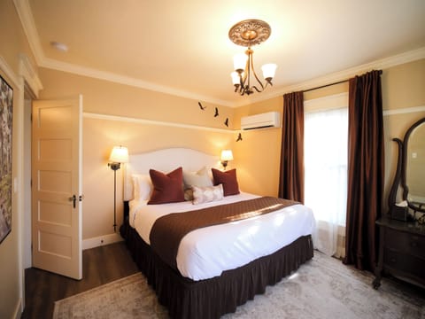 A charming bedroom with rich tones and warm lighting for a restful night.