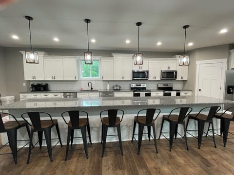 Double dishwashers, ranges, microwaves and large sink. 16 ft island with 8 seats