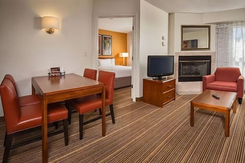 Unwind in a spacious suite with cozy fireplace ambiance