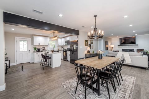 View from front entry looking into kitchen, dining area (with seating for 8) and living room
