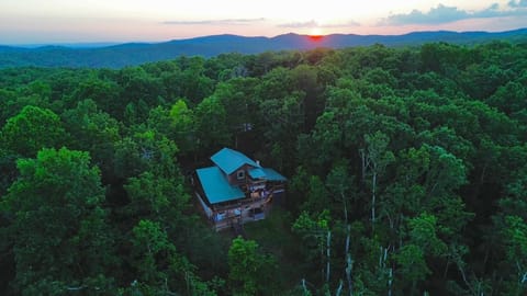 View of the back of the house with sunset in the background.