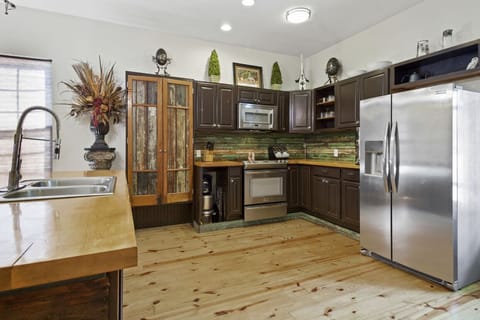 Level 1 kitchen with maple wood island for entertaining dining