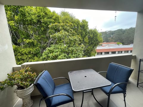 Great covered balcony with view of the hills