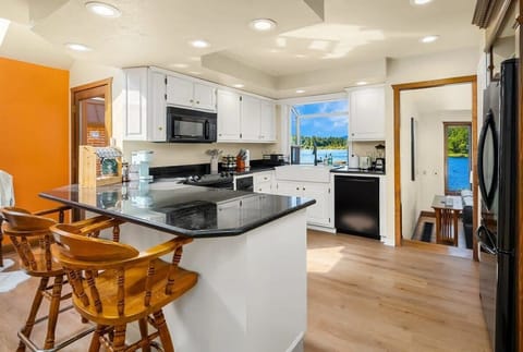The kitchen island with two chairs