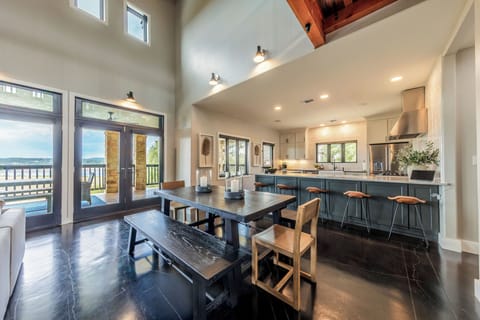 Dining table sits 8, comfortably,  plus additional seating for 5 at the bar