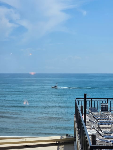 New Smyrna looking for dolphins from balcony. 