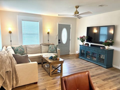 Open plan living room to dining room to kitchen.