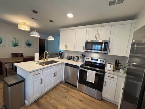 Kitchen has all stainless steel, full size appliances.