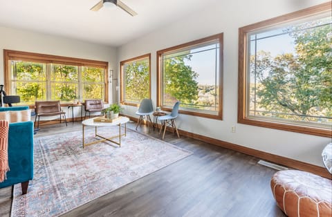 The sun/music room has beautiful views of the lake and private wooded backyard