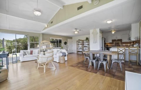 Large living room & dining area with tons of natural light