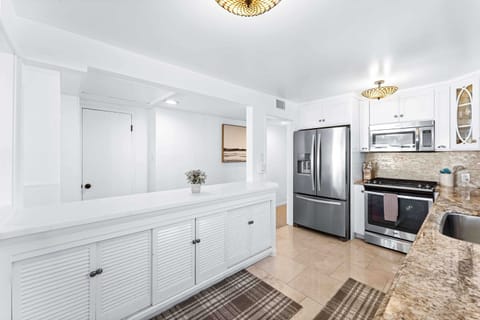 The kitchen is fully equipped with all cooking essentials and features top tier appliances.